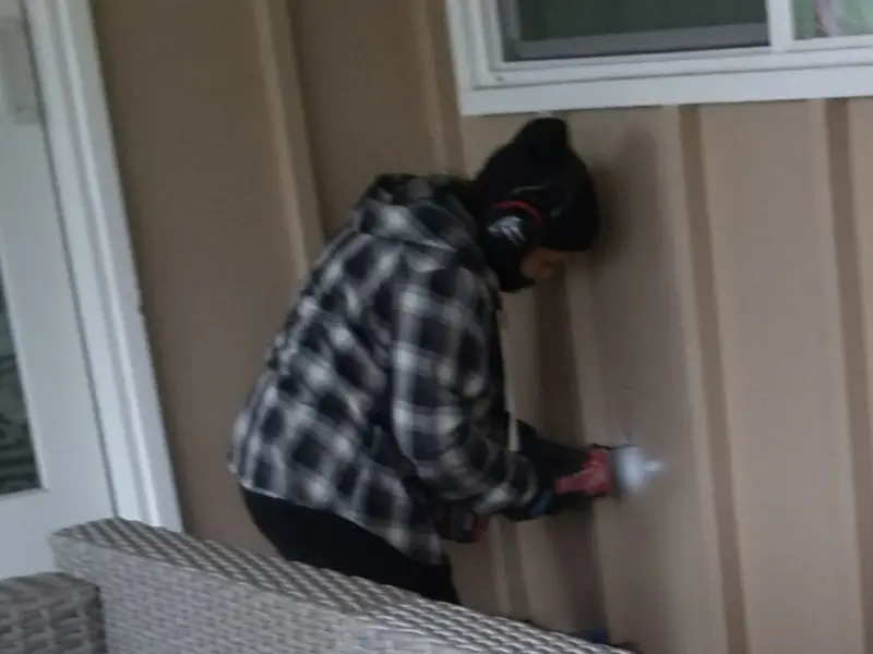 Professional electrician installing an exterior outlet in Georgia
