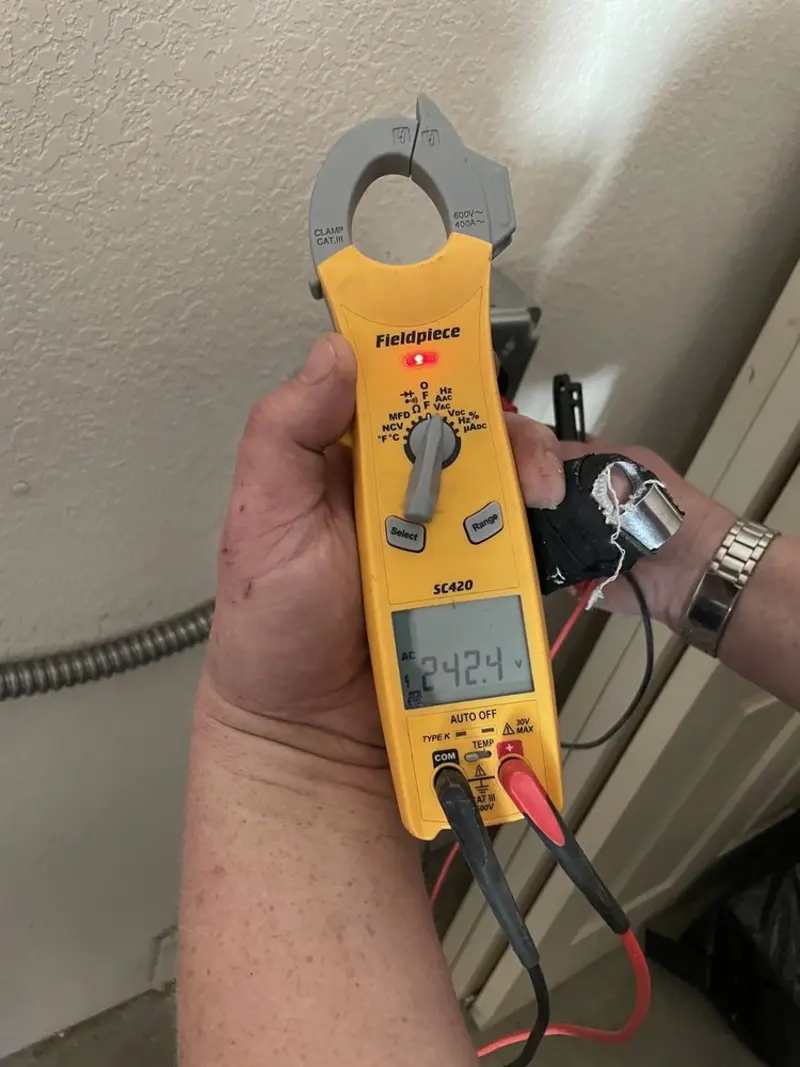 Voltage testing with clamp meter during Electrical Installation Services in Georgia
